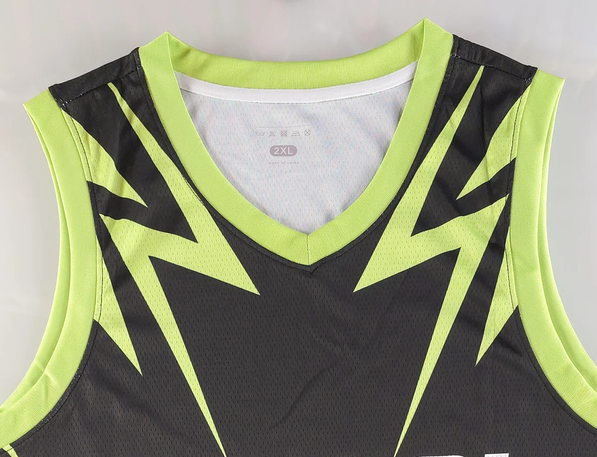 Close-up of neon green V-neck binding on a POXIOL basketball jersey
